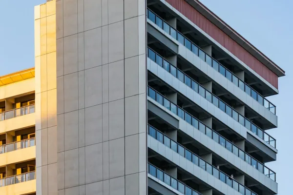 Modern apartment building with balconies against sky